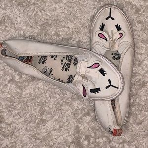 White sneakers with cute lamb face.